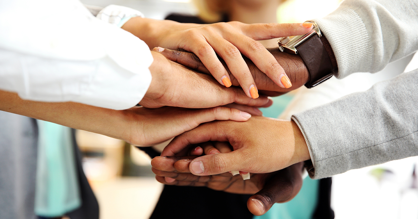 Storyblocks-stacked-hands-stock-photo-0o1a3209-970-1