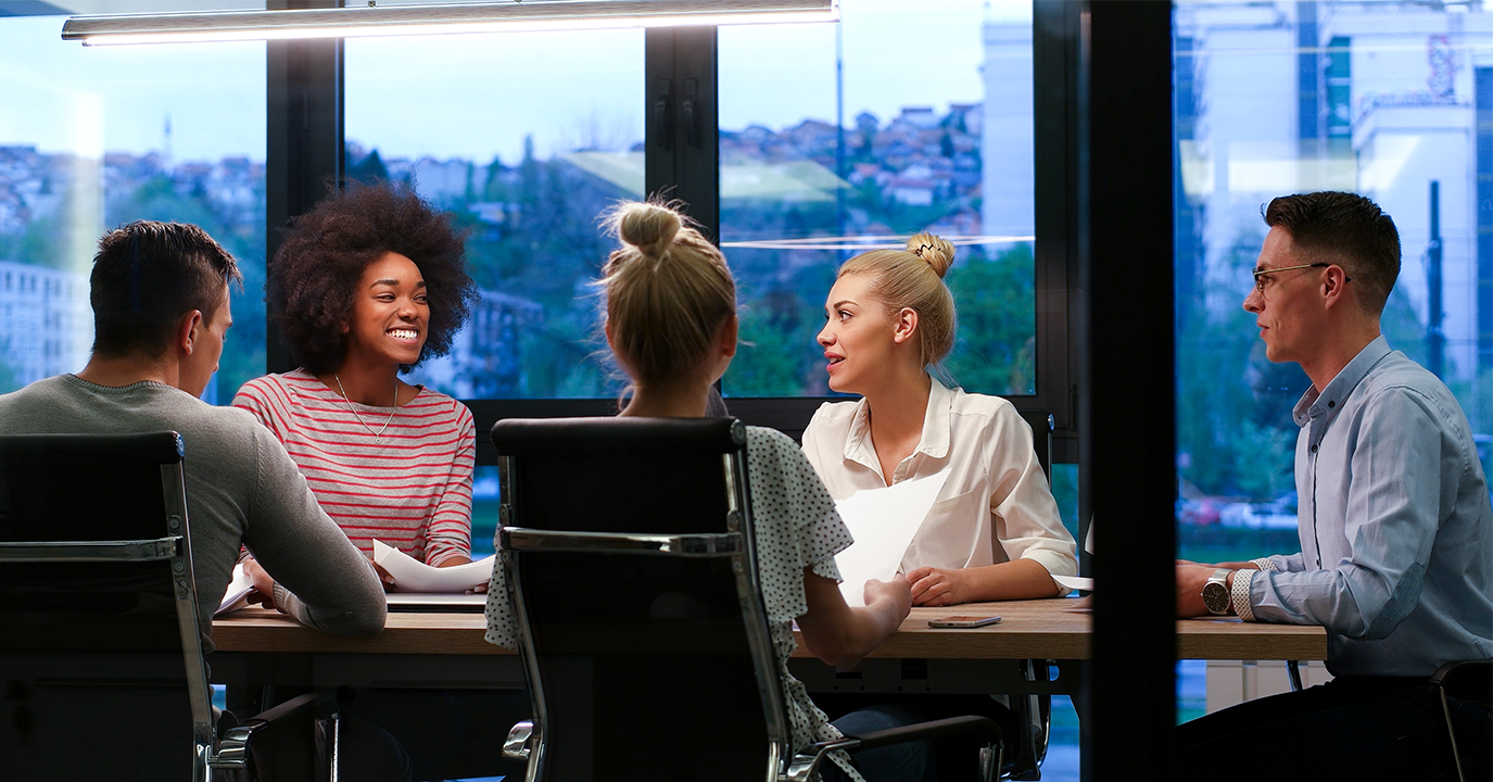 storyblocks-multiethnic-startup-business-team-on-meeting-in-modern-night-office-interior-brainstorming-working-on-laptop_SO8FzwIdhb1375x720